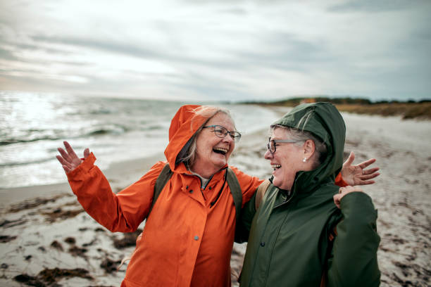 istock Seniors walking by the beach 1174028268