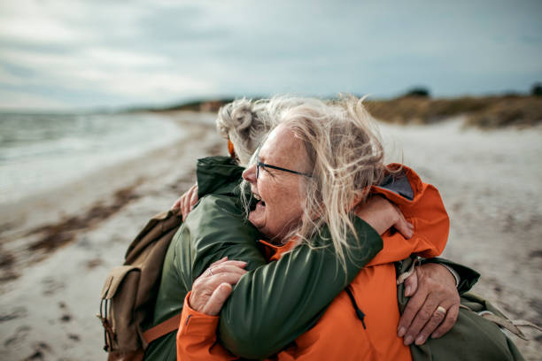 istock Seniors walking by the beach 1174032702
