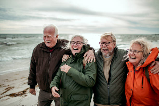 istock Seniors walking on the beach 1174033815