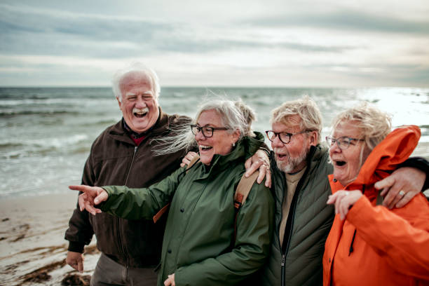 istock Seniors walking on the beach 1174034226