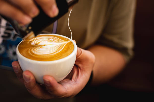 istock Latte art, milk foam pour on coffee. 1174035618