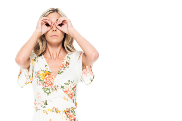 istock Cute blond female - is looking into binoculars 1174036240