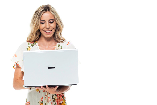 Cute blond female - using a laptop