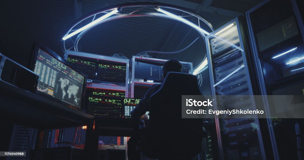 Hacker Using Computer With Multiple Monitors Stock Photo - Download ...
