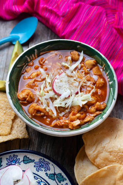 istock Mexican red pozole soup on wooden background 1174041606