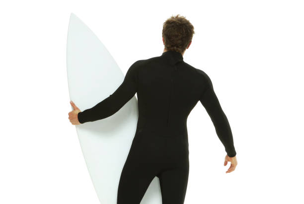 one man only / waist up / rear view of 20-29 years old adult handsome people caucasian male / young men in front of white background wearing wetsuit / swimwear who is excited / happy / smiling / successful / shouting and celebration - thank you excitement waist up horizontal imagens e fotografias de stock