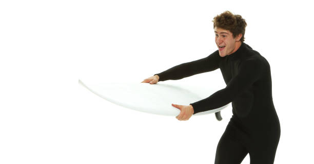 one man only / waist up / side view / profile view of 20-29 years old adult handsome people caucasian male / young men in front of white background wearing wetsuit / swimwear who is excited / happy / smiling / successful / shouting and celebration - thank you excitement waist up horizontal imagens e fotografias de stock