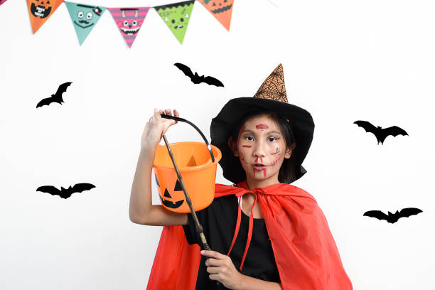 istock Asian girl with witch costume, halloween concept. 1174046532