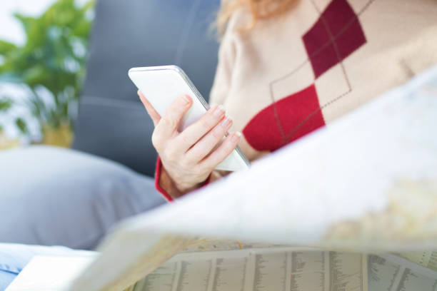 istock hand with mobile phone pointing to the map, travel and vacation 1174046848