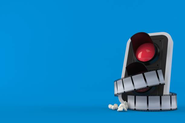 istock Red traffic light with film strip 1174052906