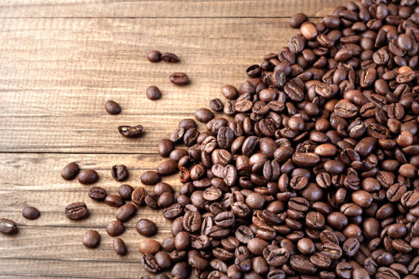 istock Roasted coffee beans background. Organic coffee. Close Up. 1174055444