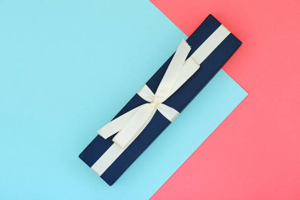 istock Beautiful gift box on a pink and blue background. Flat lay top view copy space 1174057518