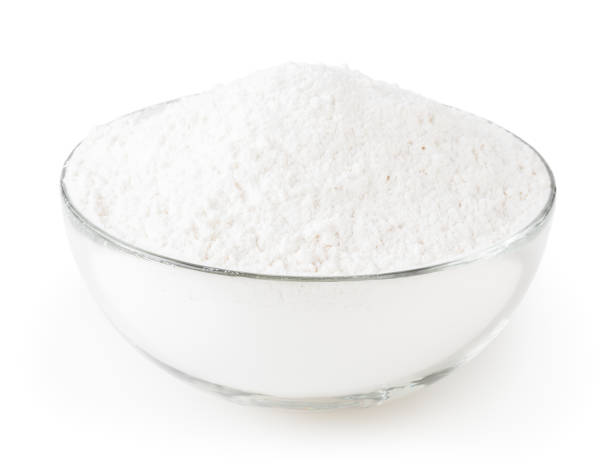 istock Wheat flour in glass bowl isolated on white background with clipping path 1174059395