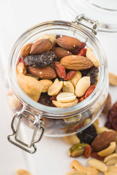 istock Mix of various nuts and raisins 1174061439