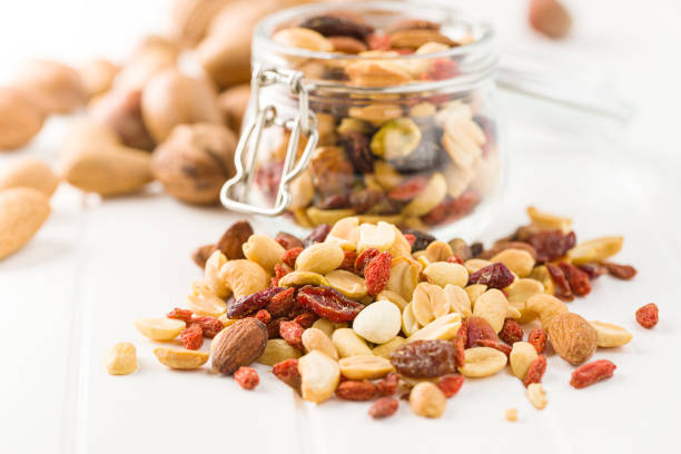 istock Mix of various nuts and raisins 1174061489