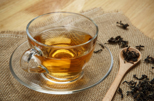 istock Vintage tea and leaves tea on sacking background 1174061584