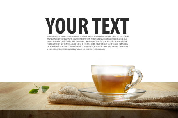 Cup of tea with sacking on the wooden table, isolated white background