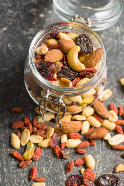 istock Mix of various nuts and raisins 1174061641