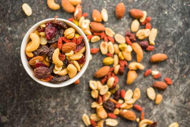 istock Mix of various nuts and raisins 1174061660