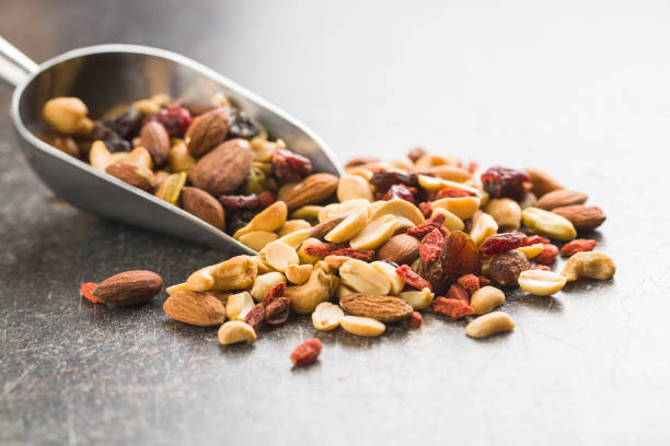 istock Mix of various nuts and raisins 1174061706