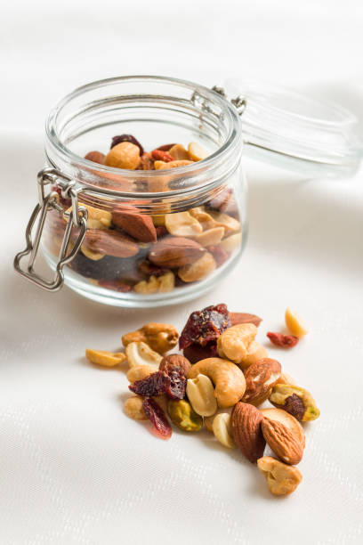 istock Mix of various nuts and raisins 1174061766
