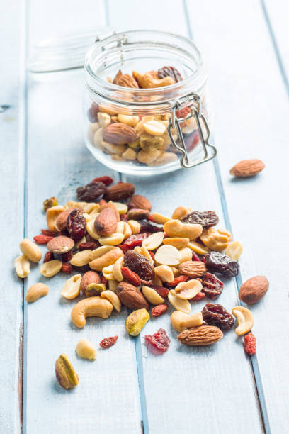 istock Mix of various nuts and raisins 1174061767