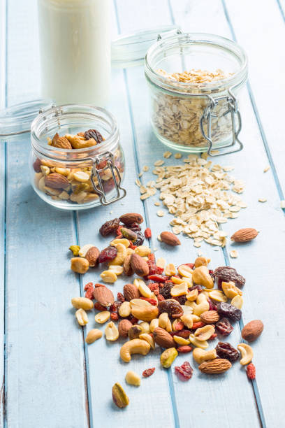 istock Mix of various nuts, raisins and oatmeal. 1174061845