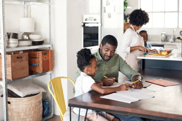 istock Helping his little girl with her homework 1174066041