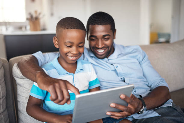 istock Teaching him about the world of technology 1174067834