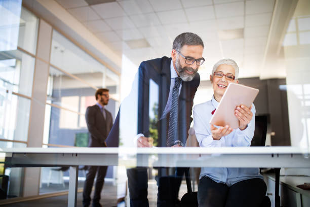 istock Collaboration and analysis by business people working in office 1174074539