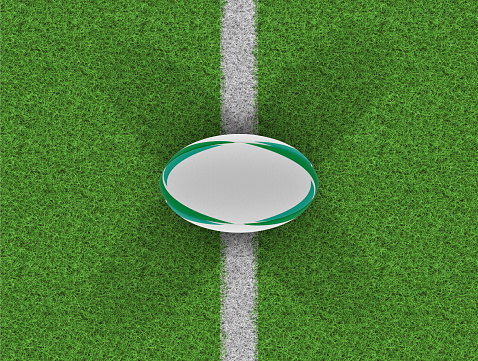 A top view of a white textured rugby ball with green design elements on a grass pitch with markings - 3D render