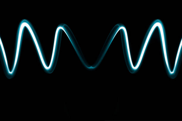 istock Abstract wave of electric neon blue light on a dark background Simple and modern design 1174082191