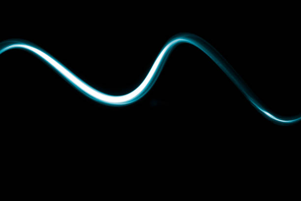 istock Abstract wave of electric neon blue light on a dark background Simple and modern design 1174082193