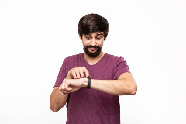istock Excited brunet bearded man with moustaches checking notification with smart watches. Using modern technologies in everyday life. 1174088175