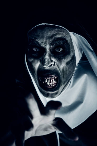 frightening evil nun with bloody teeth - bad habit imagens e fotografias de stock