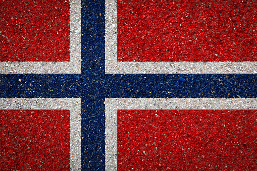 National flag of Norway on a stone background.The concept of national pride and symbol of the country.