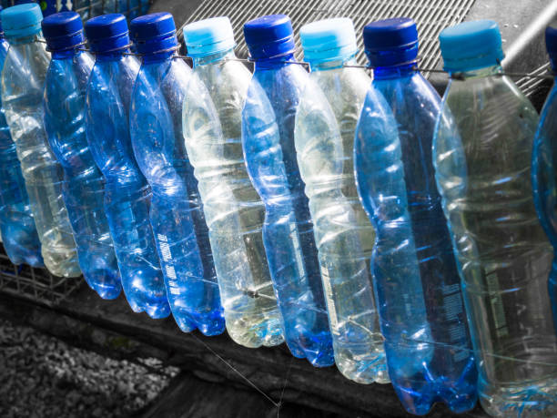 istock Composition with plastic bottles of mineral water, selective focus. Plastic waste 1174089508