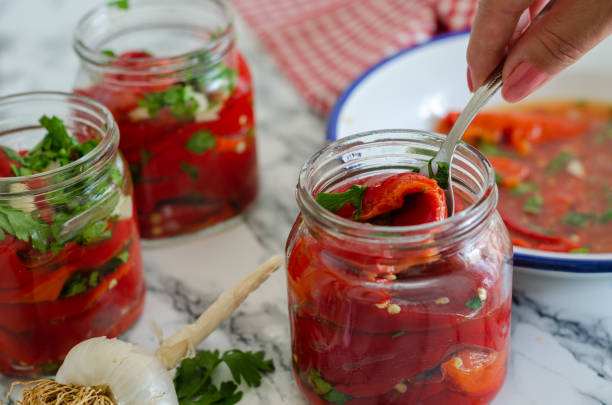 istock Pickle preparation for winter with roasted peppers 1174091095