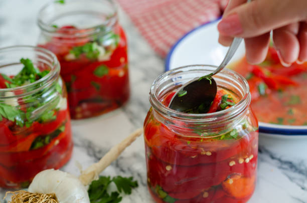 istock Pickle preparation for winter with roasted peppers 1174091127