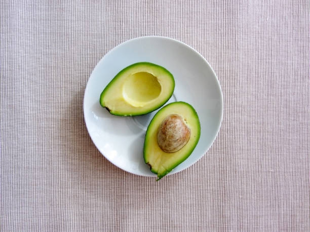 istock avocado halves on a white plate 1174091691