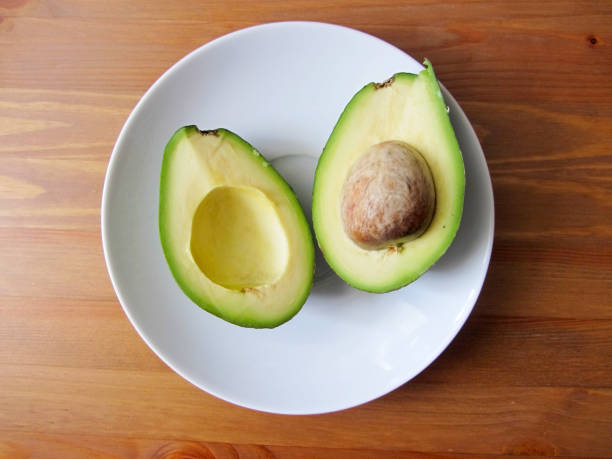 istock avocado halves on a white plate 1174091706