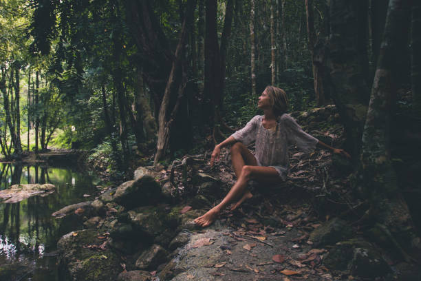 istock Beautiful young woman enjoys in nature 1174091821