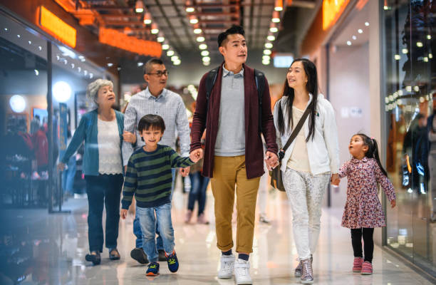 three generation chinese family shopping at hong kong mall - harbour city imagens e fotografias de stock