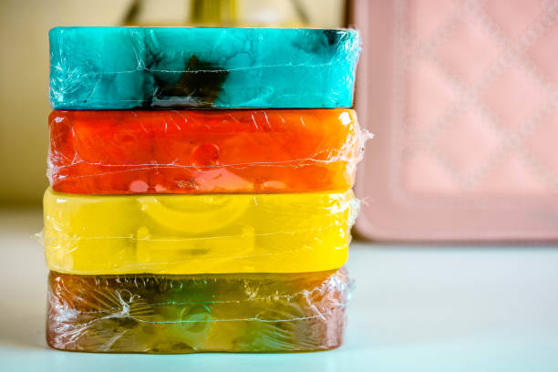istock Four different soap pieces on white table with ligt blurred background. 1174099139