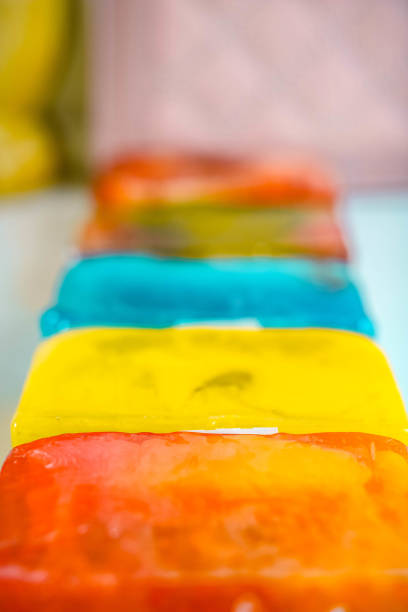 istock Many colorful handmade soap pieces lying in a line. Soft focus 1174099180