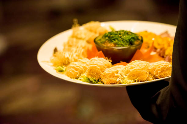 istock Waiter serving food on the plate 1174099358