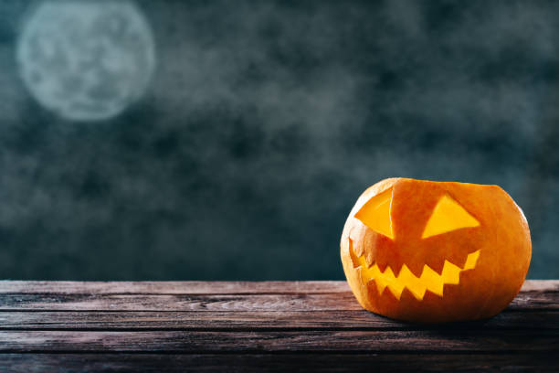 istock Halloween happy pumpkin in dark night. 1174101308