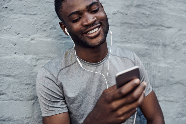 istock Choosing some tunes to pump up his workout 1174103834