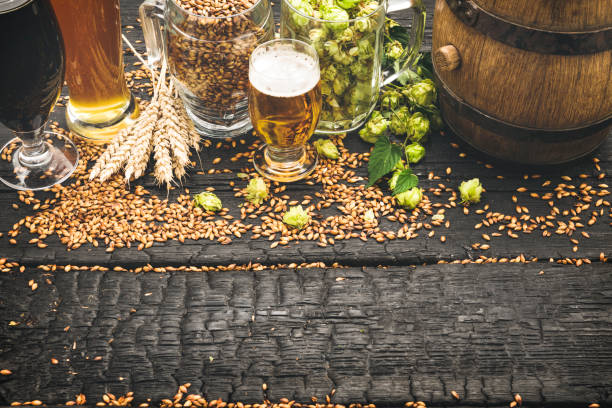 istock Glass of fresh and cold beer on dark background 1174104169