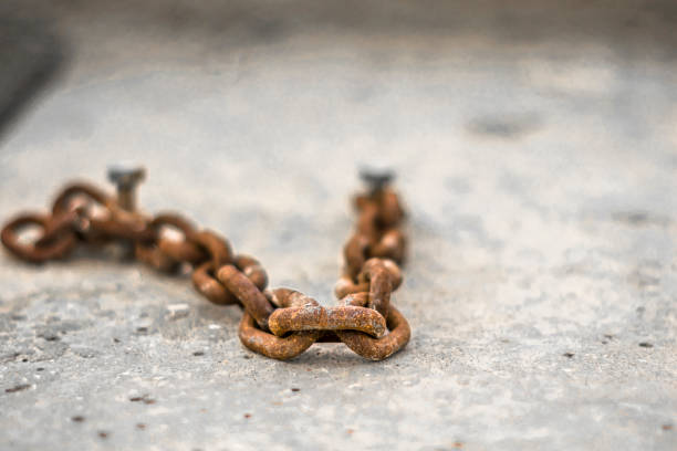 istock closeup of an old and rusty metal chain 1174105445